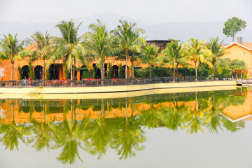 Village beside River, it is Thai local community life. a group of houses and associated buildings,...