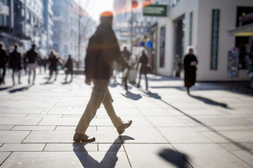 Fototapeta premium people walking on city streets
