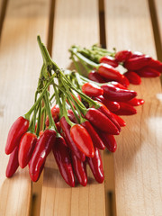 Red pepperoni peppers on a wooden table
