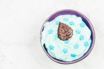 Blue ice-cream in mug, top view