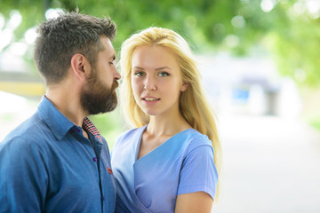 Romantic couple concept. Bearded man with blonde girlfriend.
