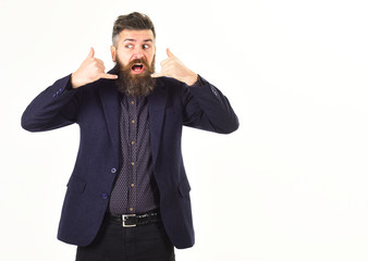 Bearded man shows call me gesture.