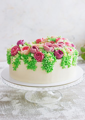 Birthday cake with flowers rose on white background