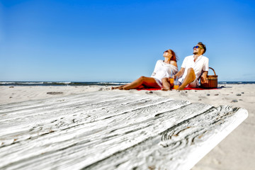 Fototapeta premium Summer desk of free space and two lovers on beach. 