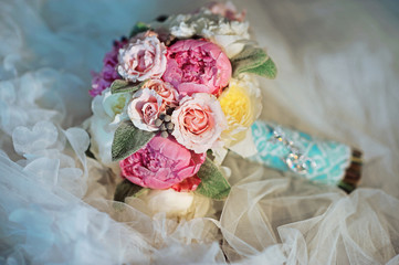 Bridal bouquet with peony on white background wedding dress close up macro