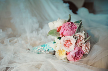 Fototapeta premium Bridal bouquet with peony on white background wedding dress close up macro