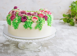 Birthday cake with flowers rose on white background