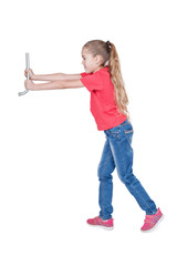 Young girl in a red T-shirt with a wheeled wrench in his hand isolated on a white background