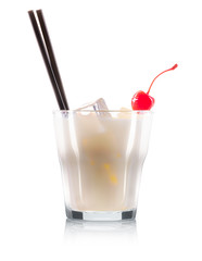 White russian or pina colada cocktail in old fashioned glass with black straw and cherry isolated on white background. Clipping path