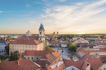 Naklejka na ściany i meble Beautiful view of the Minorit church and the panorama of the city of Eger, Hungary, at sunset