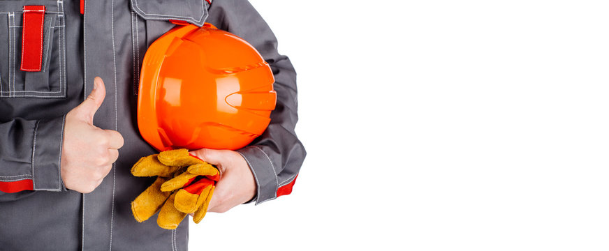 Builder worker with orange helmet in hands isolated on white background.