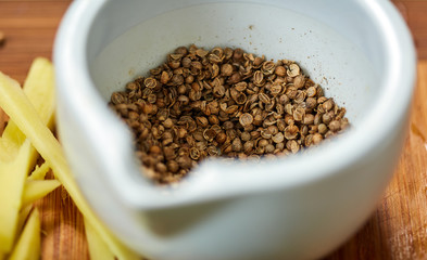 Oregano seeds in a mortar