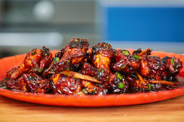 Caramelized chicken wings in closeup