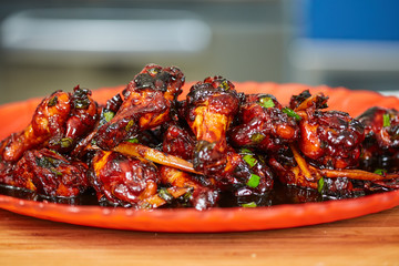 Caramelized chicken wings in closeup