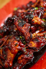 Caramelized chicken wings in closeup
