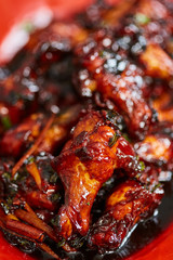 Caramelized chicken wings in closeup