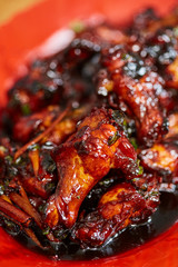 Caramelized chicken wings in closeup