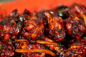 Caramelized chicken wings in closeup