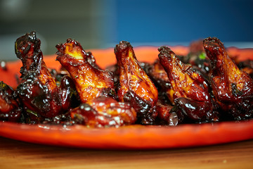 Caramelized chicken wings in closeup