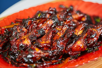 Caramelized chicken wings in closeup