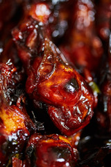 Caramelized chicken wings in closeup