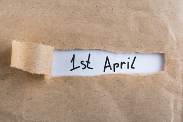 April 1st. Day 1 of april month, calendar in torn envelope. Spring time. Fools day