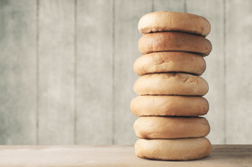 High Bagel Stack on Wood with Planked Background