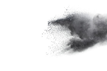 Black powder explosion against white background.The particles of charcoal splattered on white background. Closeup of black dust particles explode isolated on white background. - obrazy, fototapety, plakaty