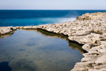 Coast landscape of Gozo Island. The Maltese archipelago limestone coastline, Dwejra Bay
