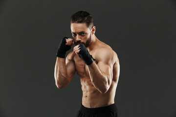 Fototapeta na wymiar Portrait of a strong shirtless muscular sportsman