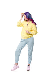 beautiful young woman pretending unicorn with waffle cone on forehead isolated on white