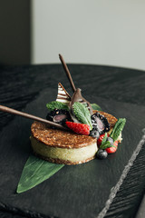 Delicious dessert with fresh berries on stone slab