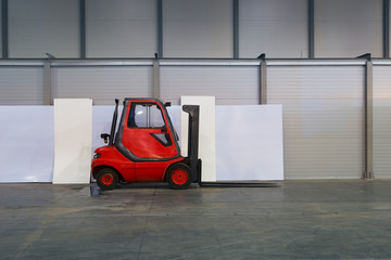 forklift truck on a large empty warehouse