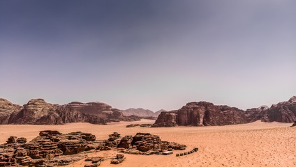 Fototapeta na wymiar Aerial view of the gigantic rocks and mountains in the nature reserve of Wadi Rum