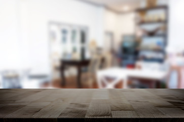 Selected focus empty brown wooden table and Coffee shop or restaurant blur background with bokeh image. for your photomontage or product display.