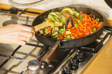 Chopped vegetables on frying pan