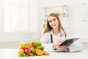 Obraz na płótnie Canvas Nutritionist desk with fruit and measuring tape