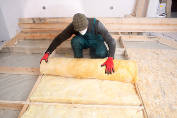 Work composed of mineral wool insulation in the floor, floor heating insulation , warm house,...
