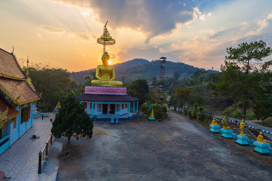 aerial photography the golden buddha statue at wat Sirattanan Mongkol near Mae Kajan Hot Spring. Wiang Pa Pao Chiang Rai Thailand.