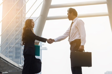 Two business people shaking hands for business succesc and complete a deal.teamwork in work for success.