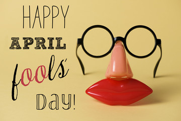 novelty glasses and text happy april fools day