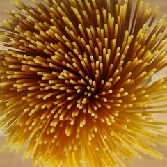 Yellow long spaghetti on a rustic background. Yellow italian pasta. Long spaghetti. Raw spaghetti bolognese. Raw spaghetti , Food background concept.