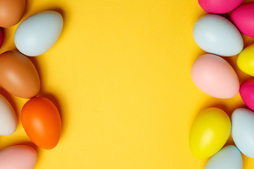 Colorful Easter eggs on a yellow background