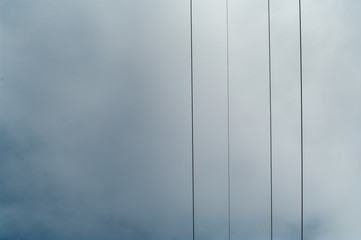 Fototapeta na wymiar Wires and the cloudy sky