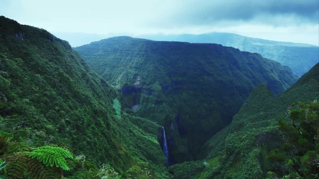 4K tropical island Nature timelapse. Clouds & rays of sun moving fast over tropical forest. Trou de Fer, La R&eacute;union