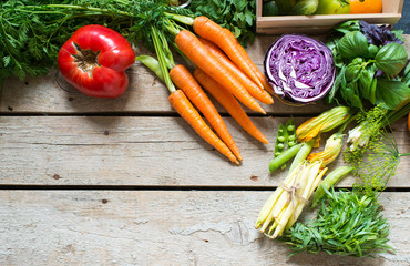 Fresh vegetables on a wooden background