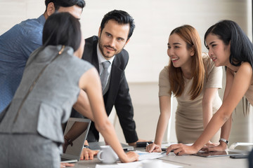 Businessmen were brainstorming about their jobs. Business Corporation Organization Teamwork Concept.