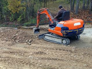Mini excavator on construction site