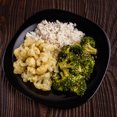 cauliflower and broccoli on a rustic background