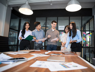 Business team analyzing income charts and graphs